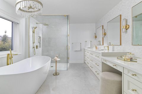 Modern bathroom with a freestanding tub and glass shower enclosure.