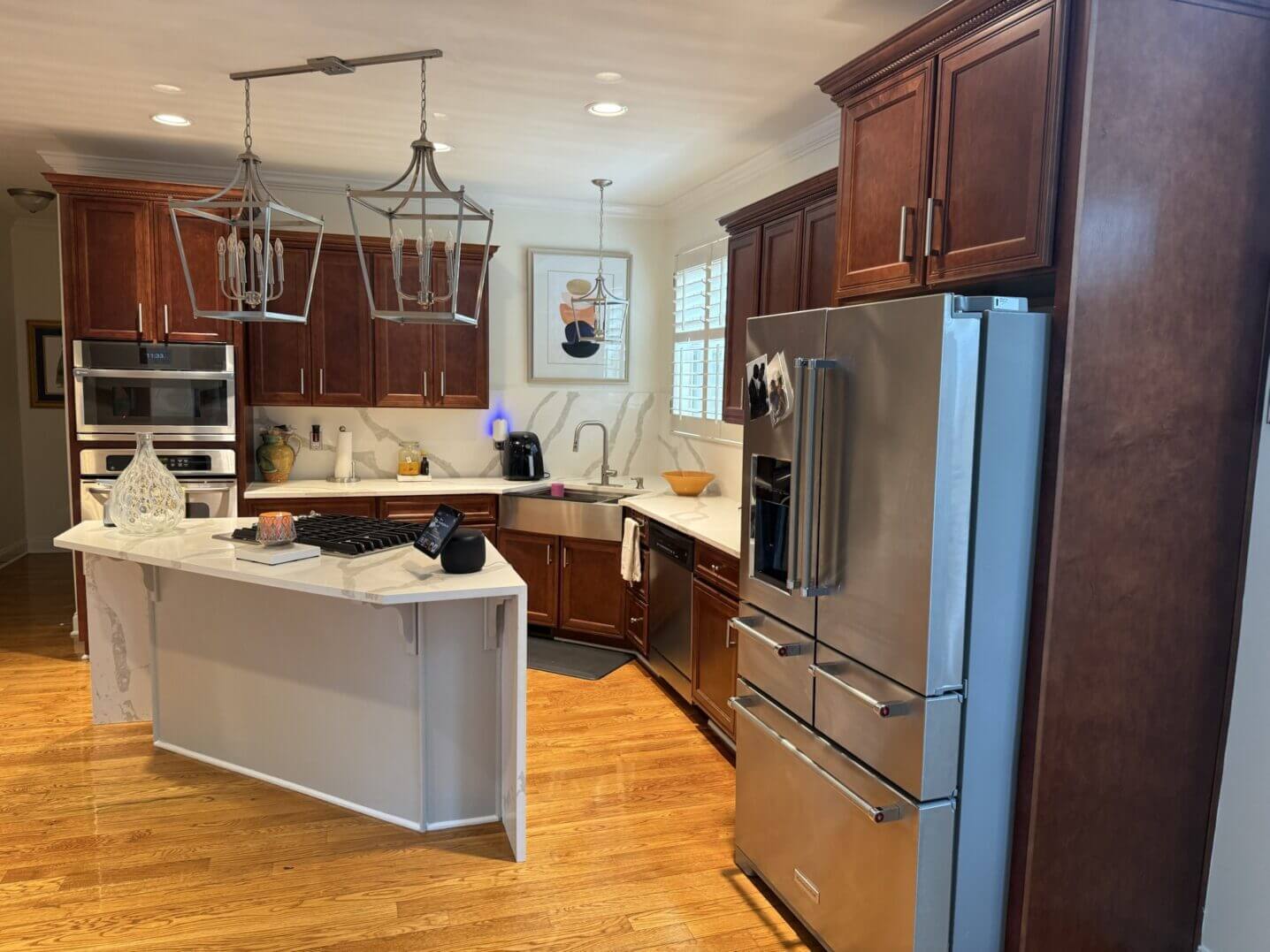 Modern kitchen with wooden cabinets and stainless steel appliances.